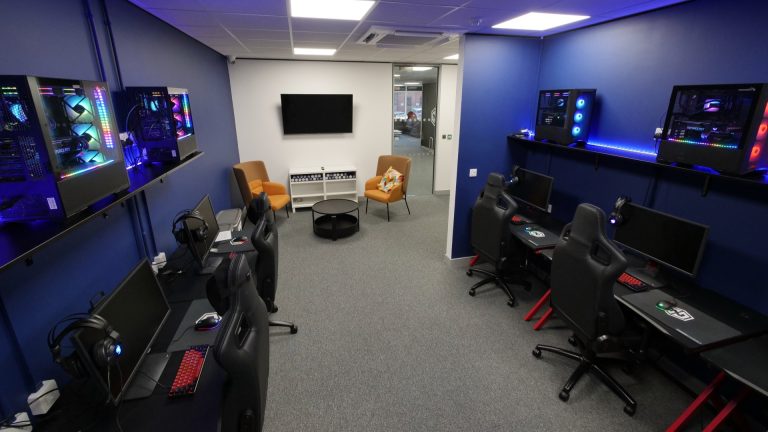 Image of Endpoint bootcamp with a number of gaming PCs and peripherals on desks