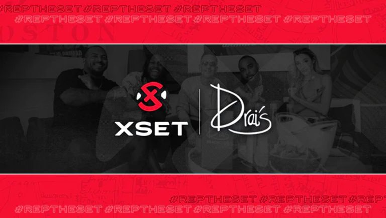 Screenshot of XSET and Drai's logo on a background of people sitting at a table