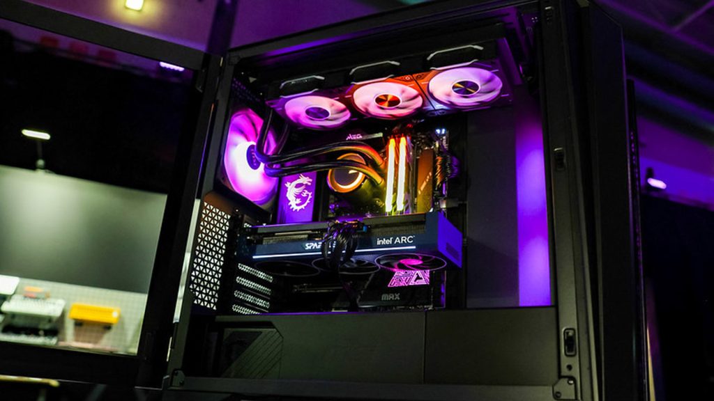 Image of Intel computer lit up by purple lights