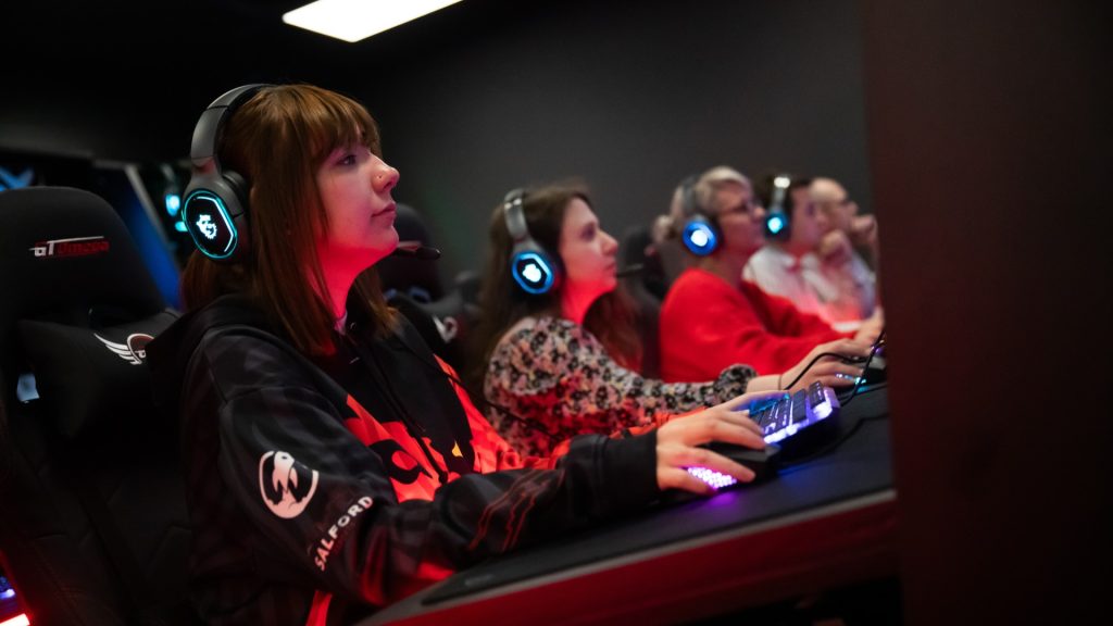 Image showing University of Salford students playing video games inside new esports room